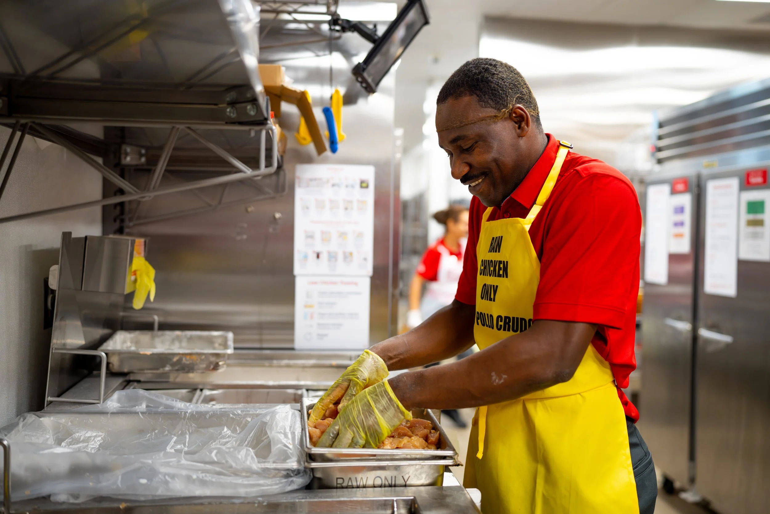 Team member preparing food in a restaurant kitchen